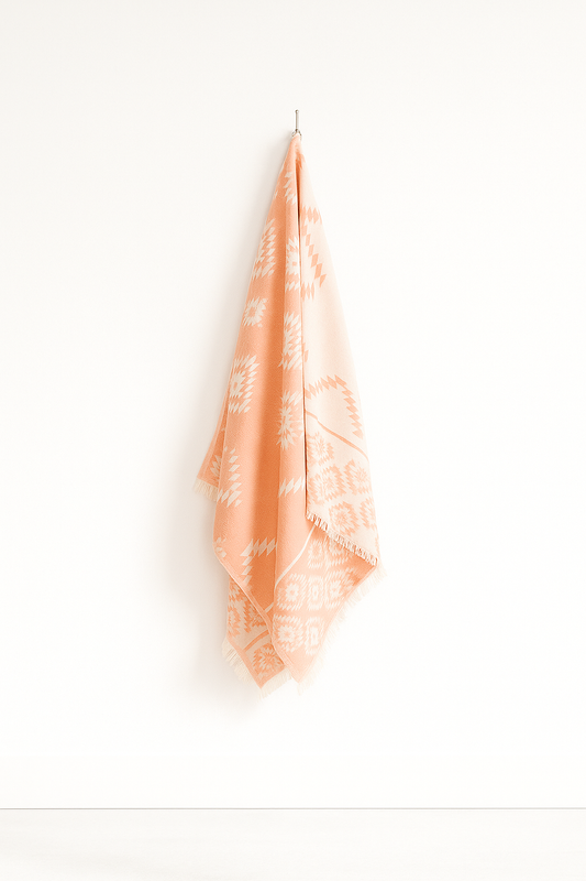 100% Cotton | Super-Soft Turkish Bath and Beach Towel in Orange (hanging on a wall)